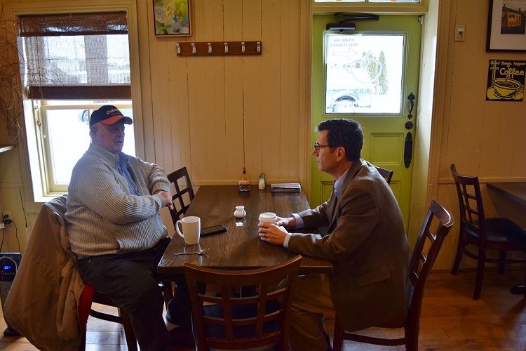 Council Member Donald meeting with a constituent at The Main Cup, Middletown. 
