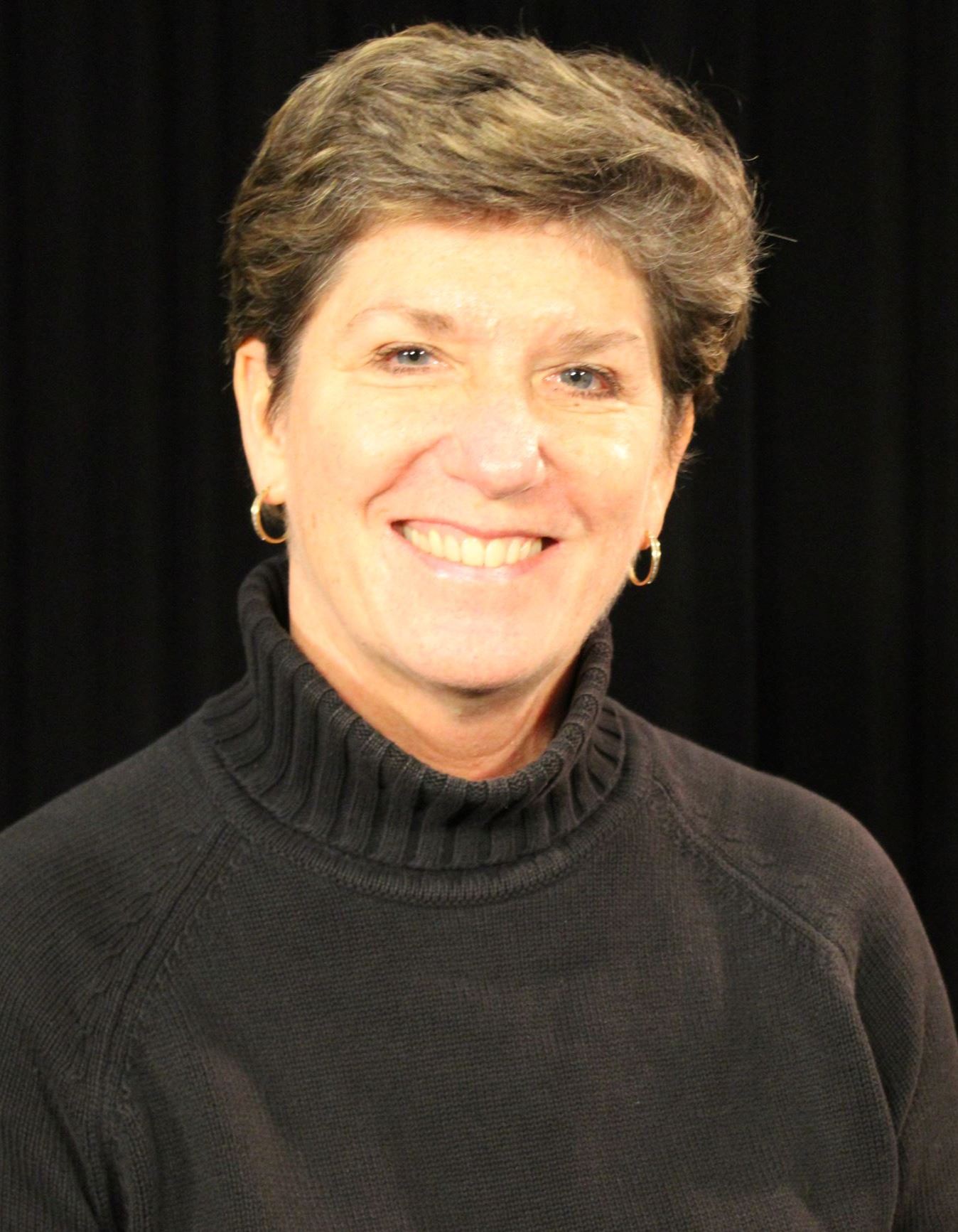 A woman poses for a photo