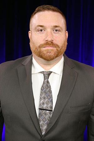 A man wearing a suit and tie